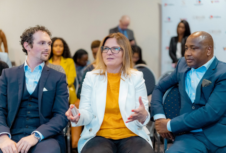 Three people in a business discussion